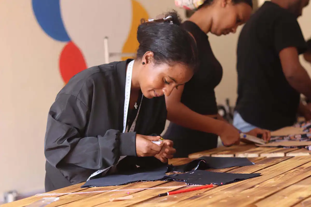 East African women, sewing and tailoring school